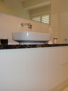 no handles on this custom vanity design with soft close doors