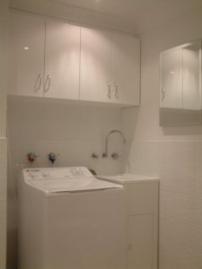 customised overhead laundry cabinet design